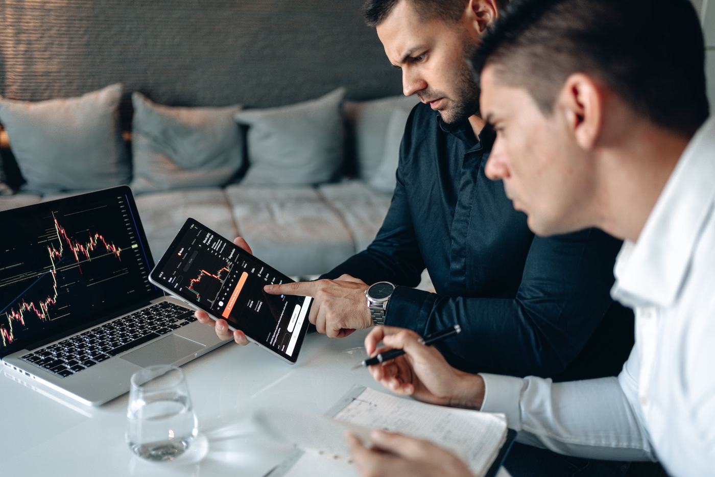 Two men checking the cryptocurrency markets