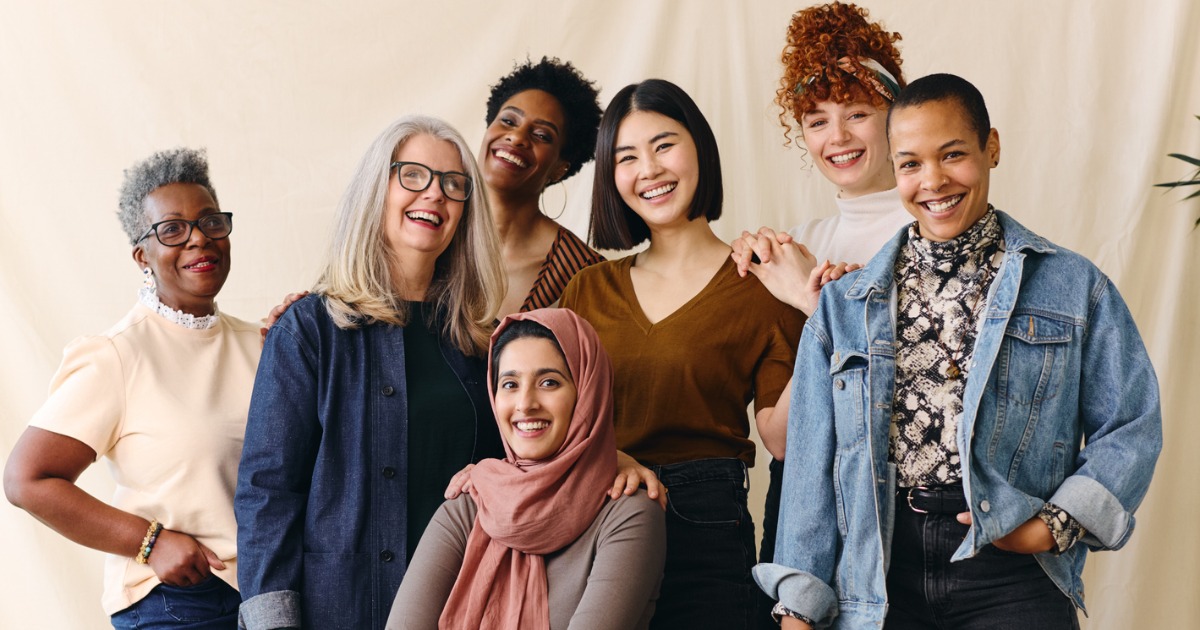 A diverse group of smiling women