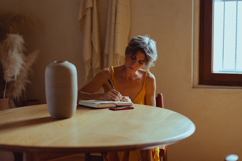 Woman writing in a notebook