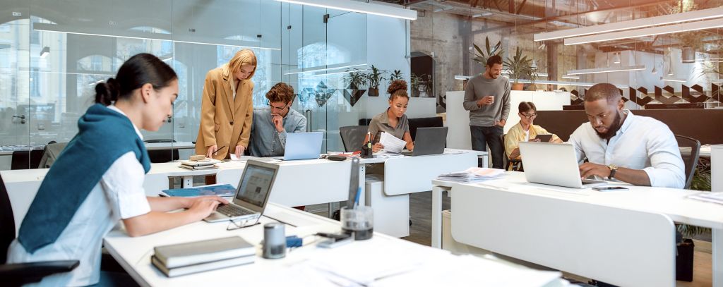 People in an office looking at computer screens