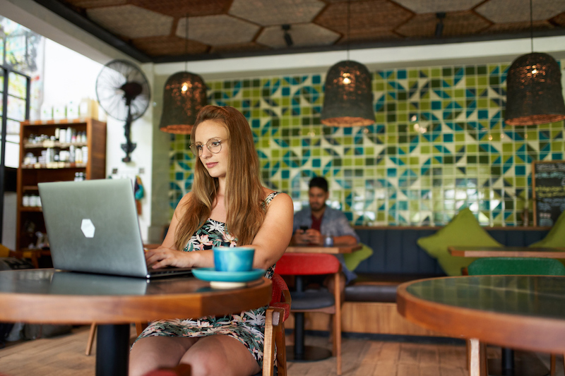 Woman on a laptop at a cafe