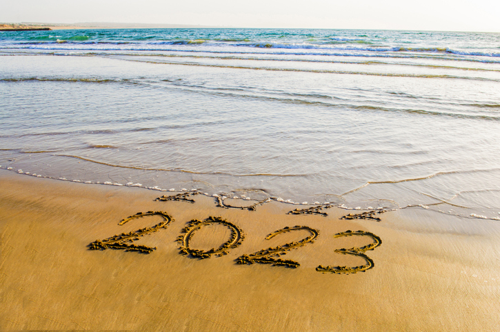 Waving washing the date from beach sand